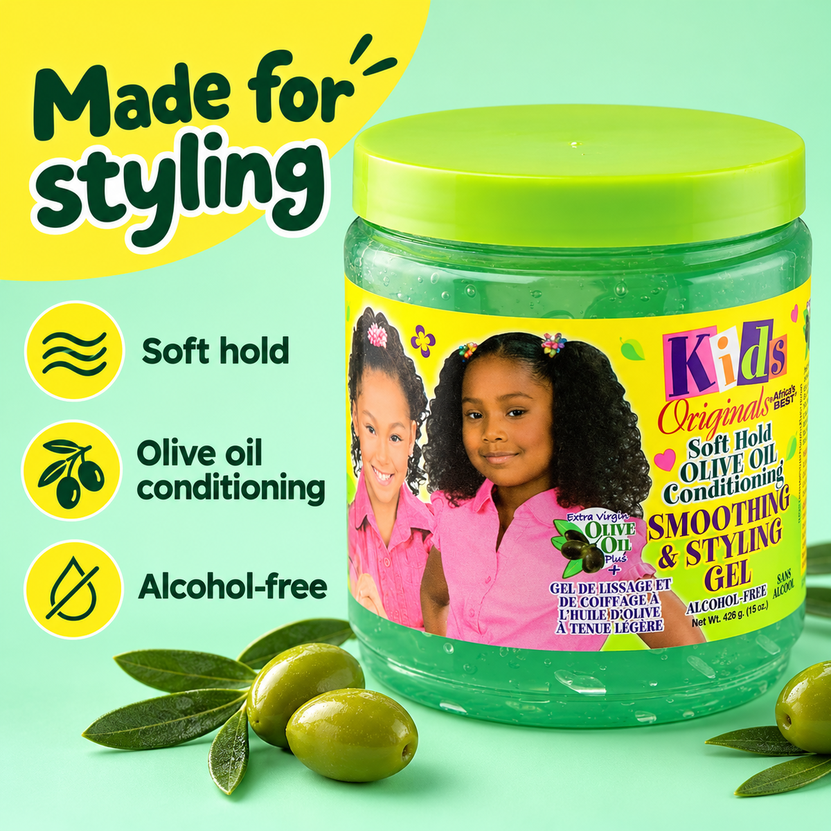 A jar of kids' soft hold olive oil conditioning smoothing & styling gel with a bright green lid and yellow label, shown on a mint green background with olives and marketing text.