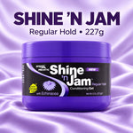 A purple jar of ampøx Pro Styler Shine 'n Jam Regular Hold Conditioning Gel, set against a purple satin fabric background with product text above.