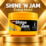A tub of Shine 'N Jam Extra Hold Conditioning Gel displayed on a gold pedestal against a gold geometric background. The product container is bright yellow with a black label featuring the brand name 'Shine 'N Jam' in white text.