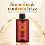 A bottle of Creme de Nature Argan Oil Treatment centered on a warm cream background with decorative gold arches and headline text reading 'Smooths & controls frizz' and 'Creme of Nature Argan Oil Treatment.' No person, animal, or real environment is present, so this is Product/Packaging rather than Lifestyle.