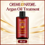 A bottle of Creme of Nature Argan Oil Treatment centered on a warm cream and gold background with decorative text above and below. The bottle is dark red-brown with a black cap and a gold-and-white label.