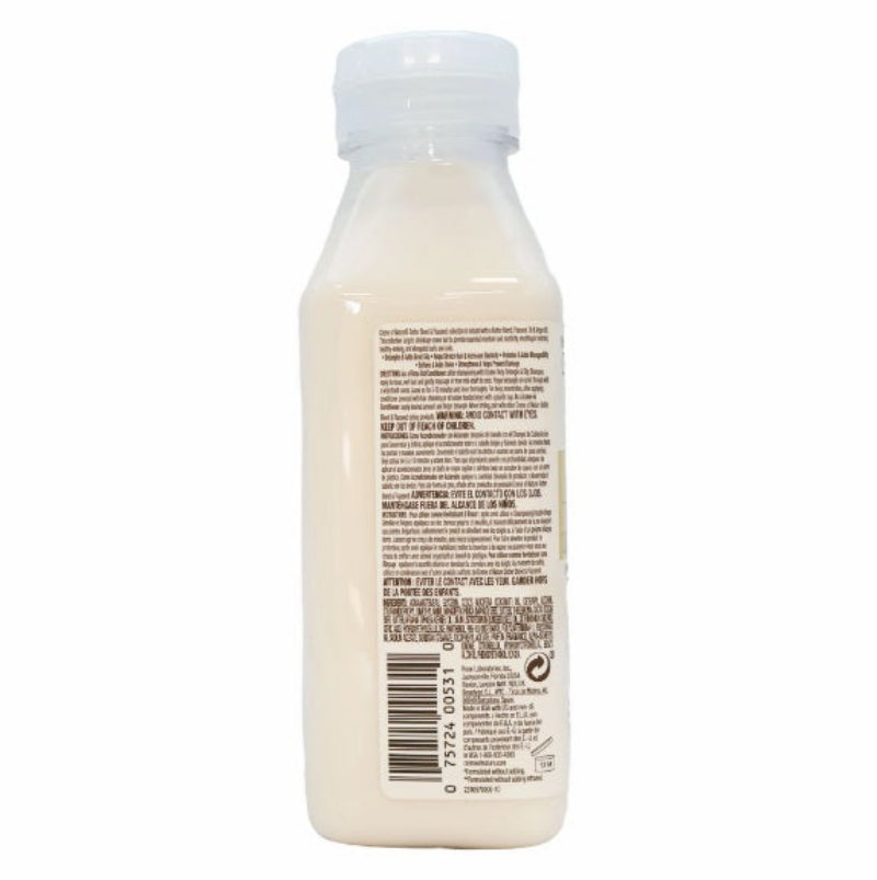 Back view of a white bottle with a label on a white background
