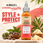 A bottle of Dr. Miracle's Strong & Healthy Black Castor & Tea Tree Restoring Hair & Scalp Oil stands on a stone surface with castor beans, a castor plant, and a piece of butter around it.