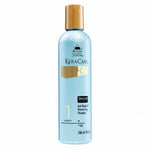 KeraCare shampoo bottle with gold cap on a white background
