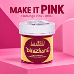 A jar of La Richie Directions Flamingo Pink semi-permanent conditioning hair color, set against a pink geometric background with promotional text.