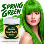 La Fiche Directions Semi-Permanent Conditioning Hair Colour in 'Spring Green'. The left side shows the product jar with a white lid and a gold label, while the right side features a model with vibrant, bright green hair showcasing the color result.