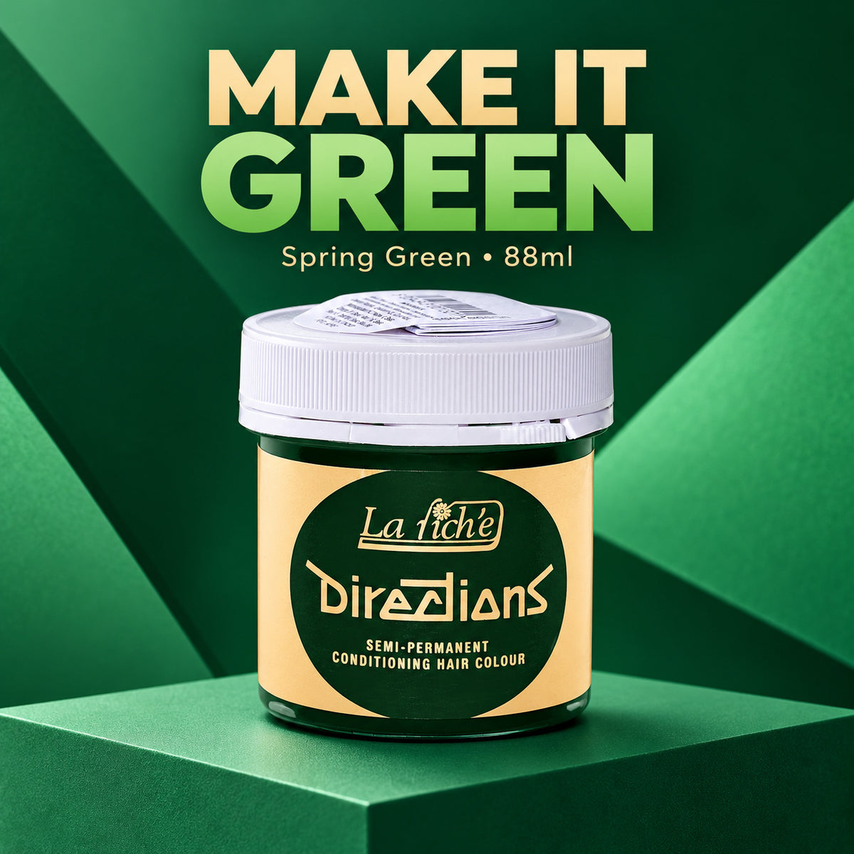 A jar of La Richie Directions Semi-Permanent Conditioning Hair Colour in 'Spring Green' is displayed on a green geometric pedestal with promotional text reading 'MAKE IT GREEN' in the background.