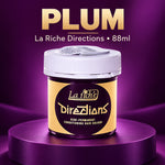 A jar of La Riche Directions semi-permanent conditioning hair colour in the shade Plum, displayed on a metallic purple pedestal against a matching purple background.