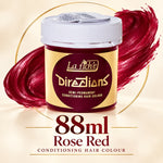 A jar of La Riché Directions semi-permanent conditioning hair colour in shade Rose Red, shown with a white lid and a gold label, set against a cream background with a red hair stroke graphic and text indicating 88ml.