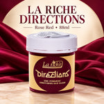 A jar of La Riche Directions Semi-Permanent Conditioning Hair Colour in the shade Rose Red, set against a luxurious dark red satin background with a cream-colored circular backdrop and bold text overlay.