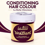 A jar of La Riche Directions Conditioning Hair Colour shown on a cream background with dark purple text and decorative swooshes. The product container has a white lid and a gold and dark purple label.