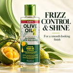 A bottle of ORS Olive Oil Frizz Control & Shine Glossing Hair Polisher stands on a glossy white surface with green leaves, whole and halved olives, and a stream of golden oil around it. Large text on the right reads 'FRIZZ CONTROL & SHINE' and 'For a smooth-looking finish.