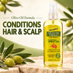 A bottle of Palmer's Olive Oil Formula Conditioning Spray Oil stands on a stone surface with olive branches and olives around it. Large text on the left reads 'Olive Oil Formula CONDITIONS HAIR & SCALP'.
