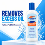 A bottle of Palmer's Skin Success Deep Cleansing Astringent with a blue cap, shown on a white and blue graphic background with water splash effects and text stating 'Removes Excess Oil'.