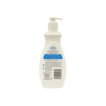 White bottle with pump and label on a white background