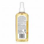 Back view of a spray bottle with a label on a white background