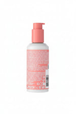 Bottle with pink pump and label on a white background