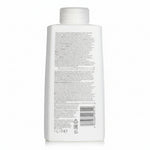 White bottle with text and a barcode on a white background