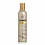 A bottle of KeraCare Natural Textures Cleansing Cream with a label indicating it is a sulfate-free moisturizing curl wash.